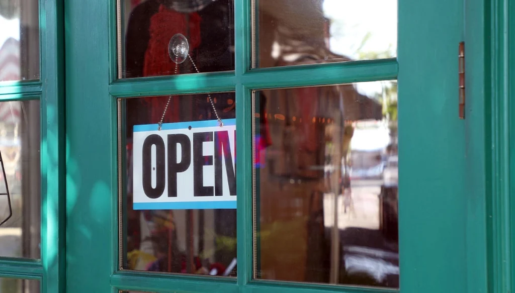 open sign in the front door of a business