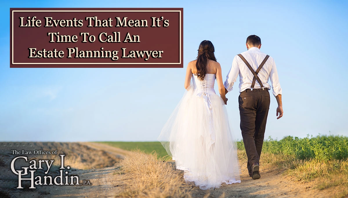 newlywed couple walking down a dirt road