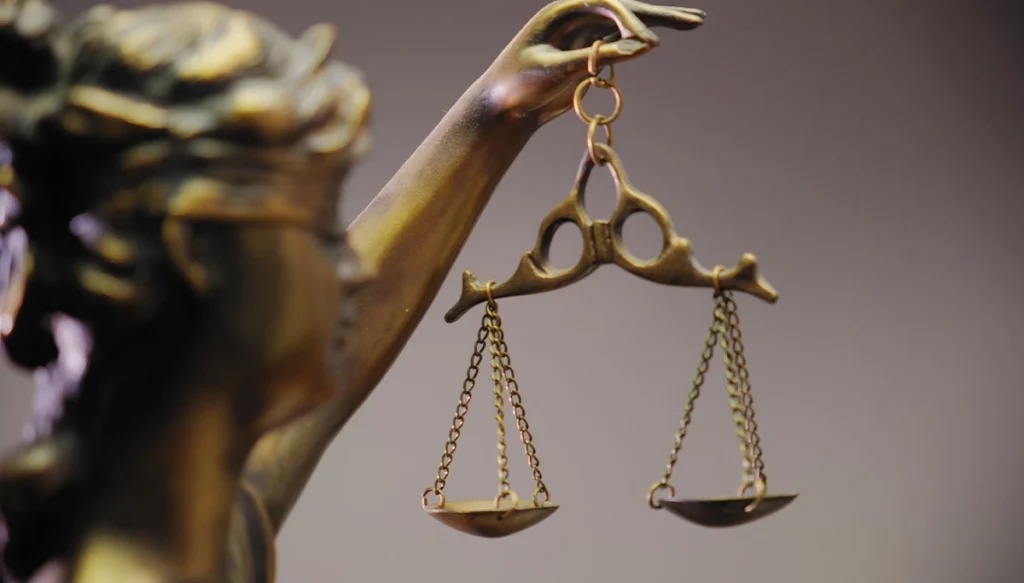 Closeup of the justice statue holding legal scales