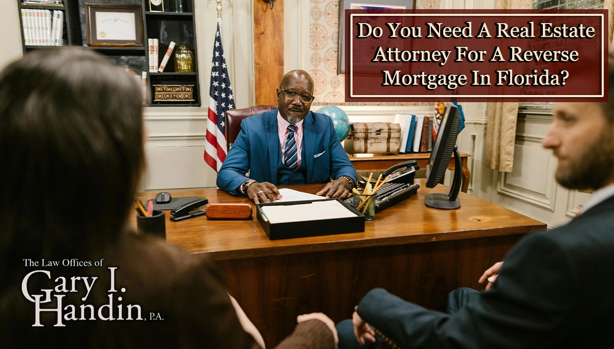Attorney at his desk sitting across from clients