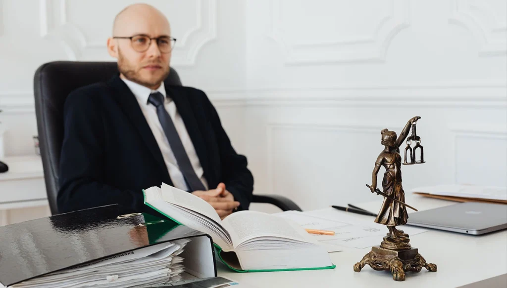 attorney leaning back in chair infront of his desk